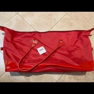 Brand new, with tag, red overnight, duffle bag